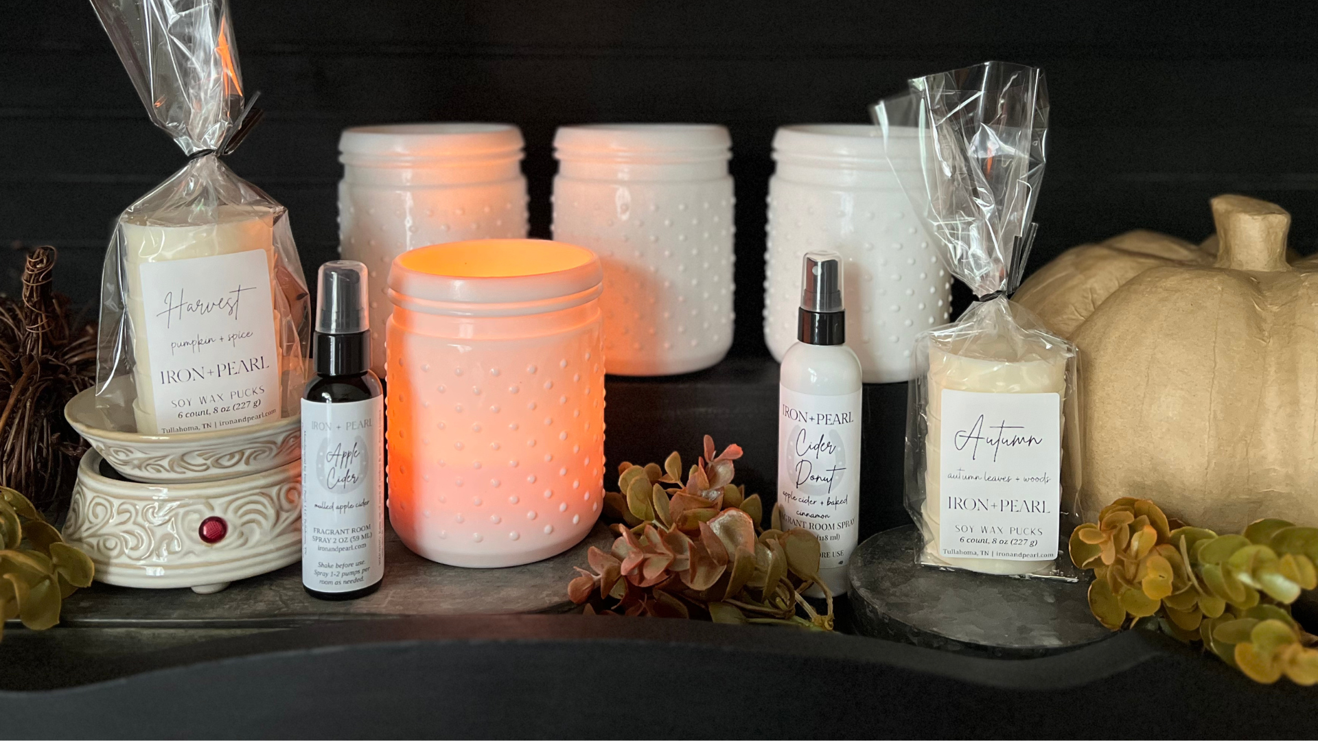 fragrant fall candles in white milk glass containers with soy wax melts and fragrant room sprays